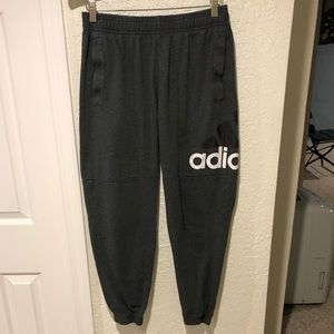 Adidas women’s size medium gray joggers with pockets.